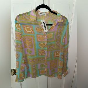 Shop Impressions long sleeve blouse!